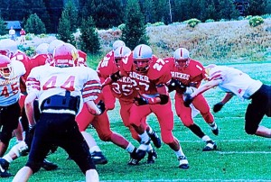 Kris Vickers and Rene Lopez open a big hole for James Van-Brunt as he shakes off a defender.