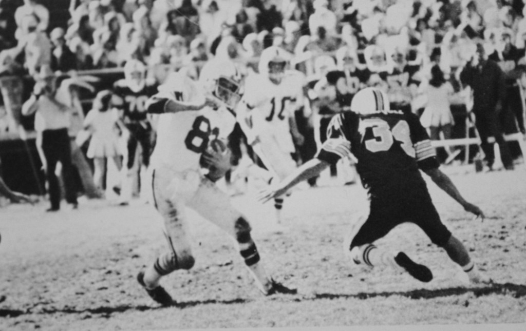 Shawn Hassell jukes Greg Velasquez (Truckee Transfer to NT) and makes good yardage after the catch at North Tahoe in 1979.