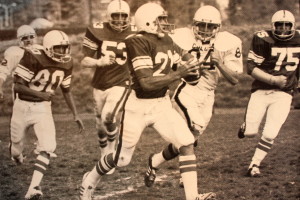Bob Gebhardt scrambles vs Colusa keeping his eyes down field. At one point during the 1980 season was ranked 2nd in Northern California in passing. 