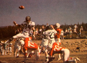 (7) John Raber gets a pass of vs Colfax, Bob Raber (32) is doing his best to protect his brother