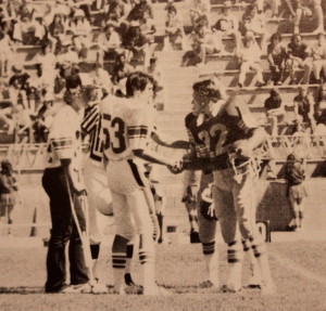 Captain Brian Arney and Rex Bergsma shake hands before the coin toss at Whittell 