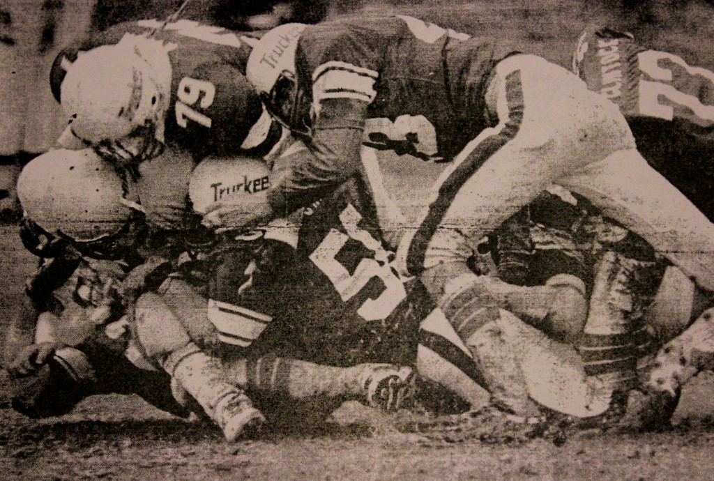 A swarm of Truckee defenders swallow up a Manogue Running back 