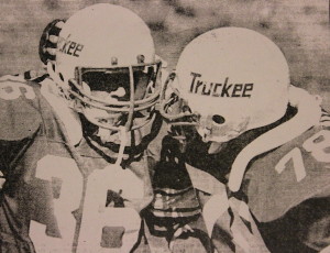 (78) teammate Alroy Waters congratulates Neptune during the Hawthorne game