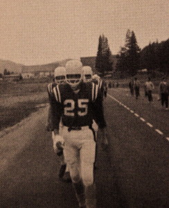 (25) Leads the team out for a home game. Quite a trek to get to the game field back in the day.