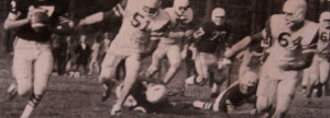 (64) Ernie Marier and (51) Wayne Kusick chase down Colfax's QB