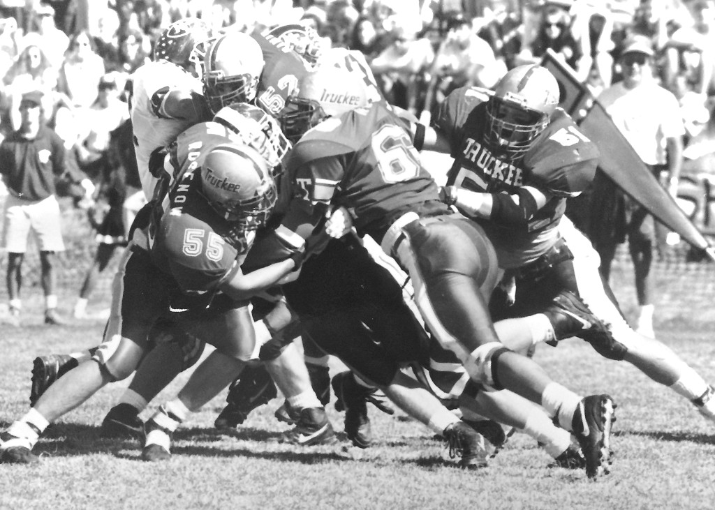 The '92 defense swarms to smother a North Tahoe ball carrier.