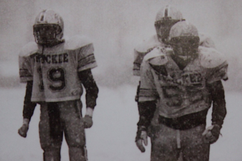 Josh Ivens and Sean Thompson await the Warriors offense to break the huddle admits a snow storm.